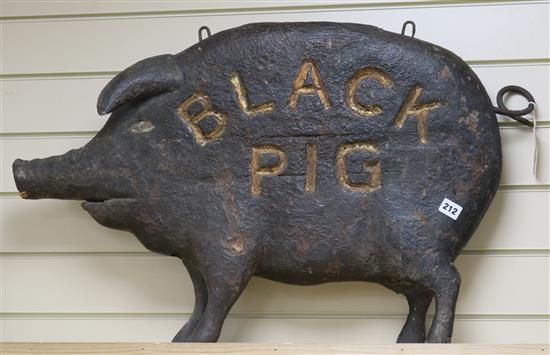 A carved wood black pig tavern sign 85cm long
